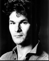 Black and white photo print of Patrick Swayze in a denim shirt.