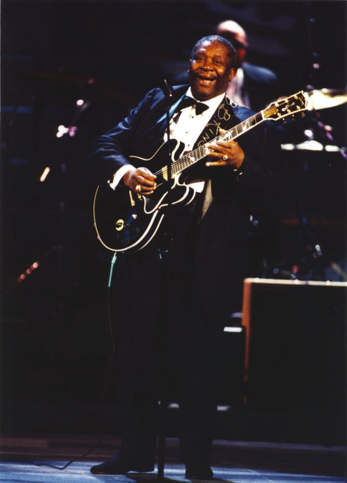 BB King performing live with Black Les Paul guitar in black suit photo print.