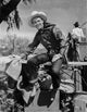 Roy Rogers seated in cowboy attire photo print