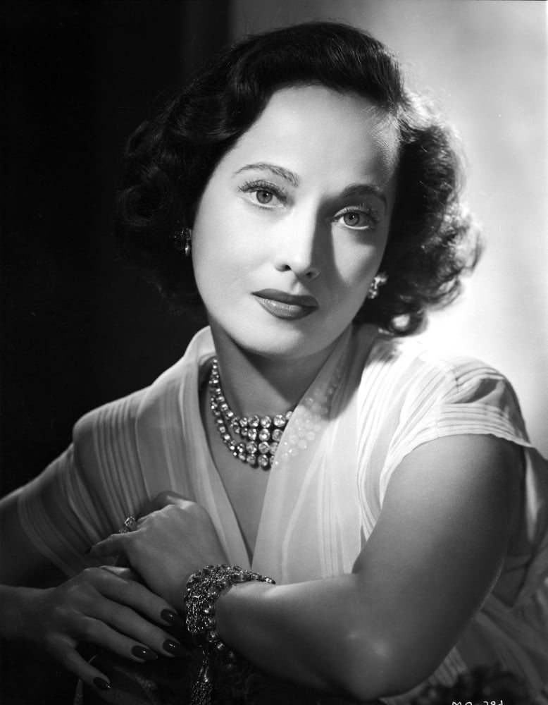 Merle Oberon leaning in a lace top photo print.