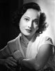 Merle Oberon leaning in a lace top photo print.