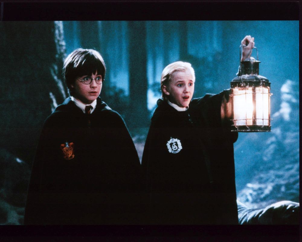 Daniel Radcliffe and Tom Felton holding lantern in Harry Potter Photo Print