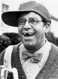 Jerry Lewis wearing glasses and a baseball cap photo print