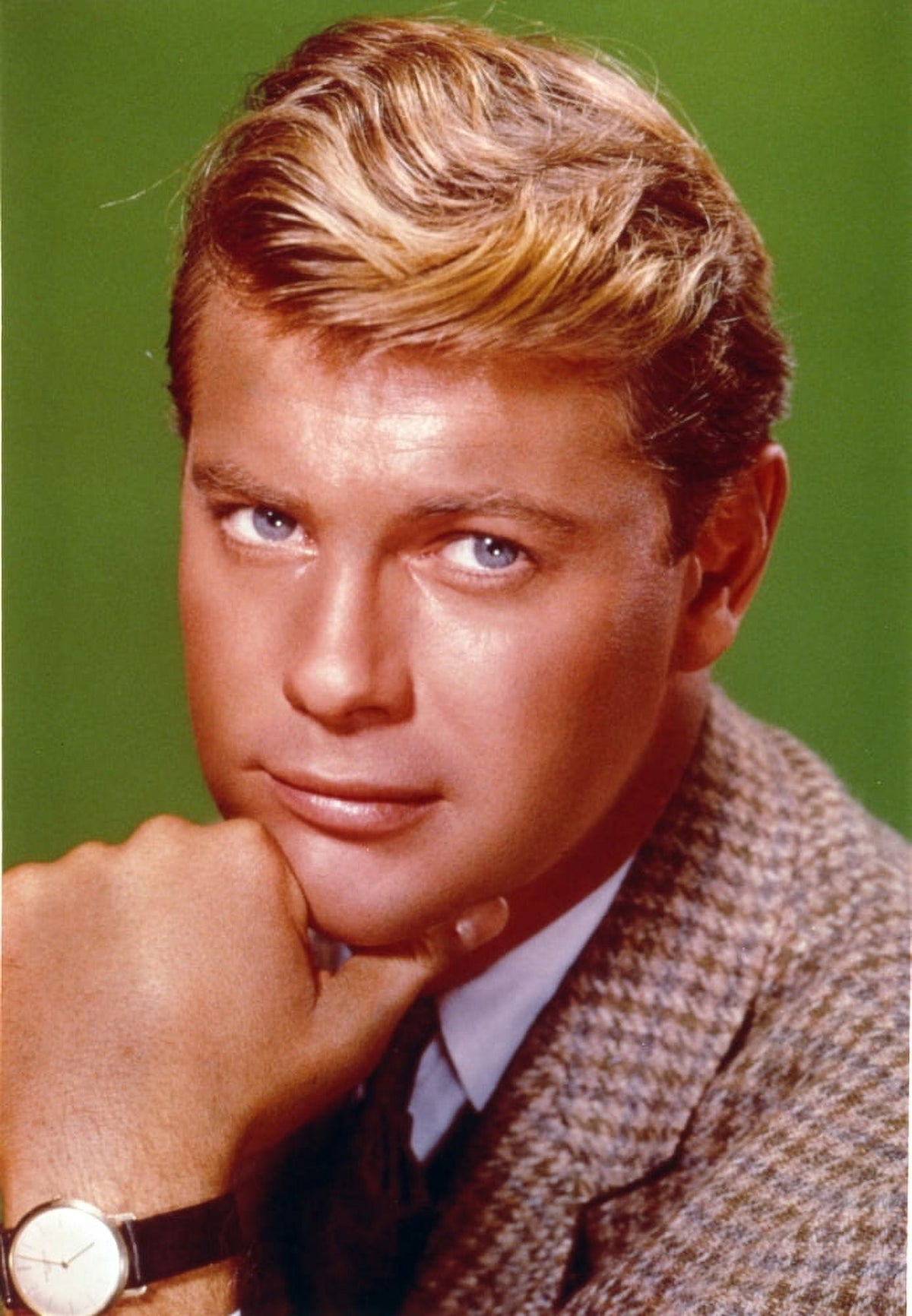 Close-up portrait photo print of Troy Donahue on a green background.