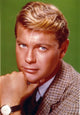 Close-up portrait photo print of Troy Donahue on a green background.