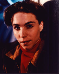 Jonathan Brandis close-up photo print in red turtleneck and coat.