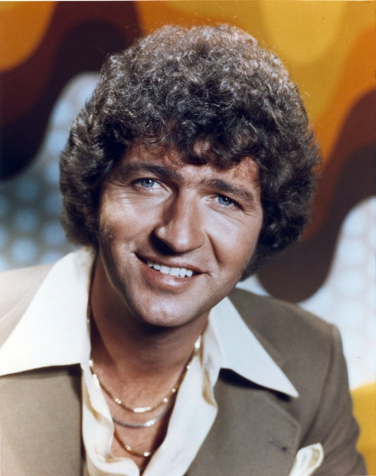 Close-up portrait photo print of Mac Davis, capturing his charming smile.