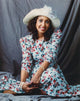 Telma Hopkins posed in floral dress and hat photo print.