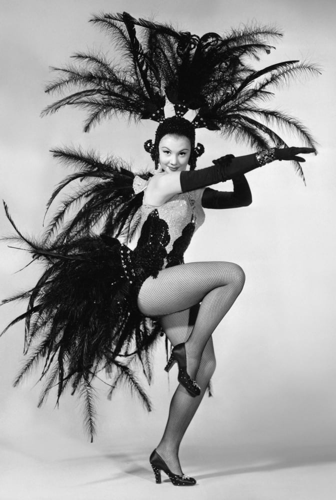 Mitzi Gaynor in showgirl costume photo print, vibrant colors, classic Hollywood charm.