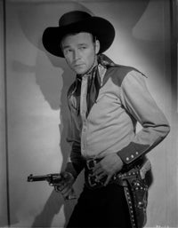 Roy Rogers leaning on wall holding a revolver photo print