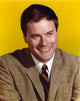 Larry Hagman smiling photo print with yellow background