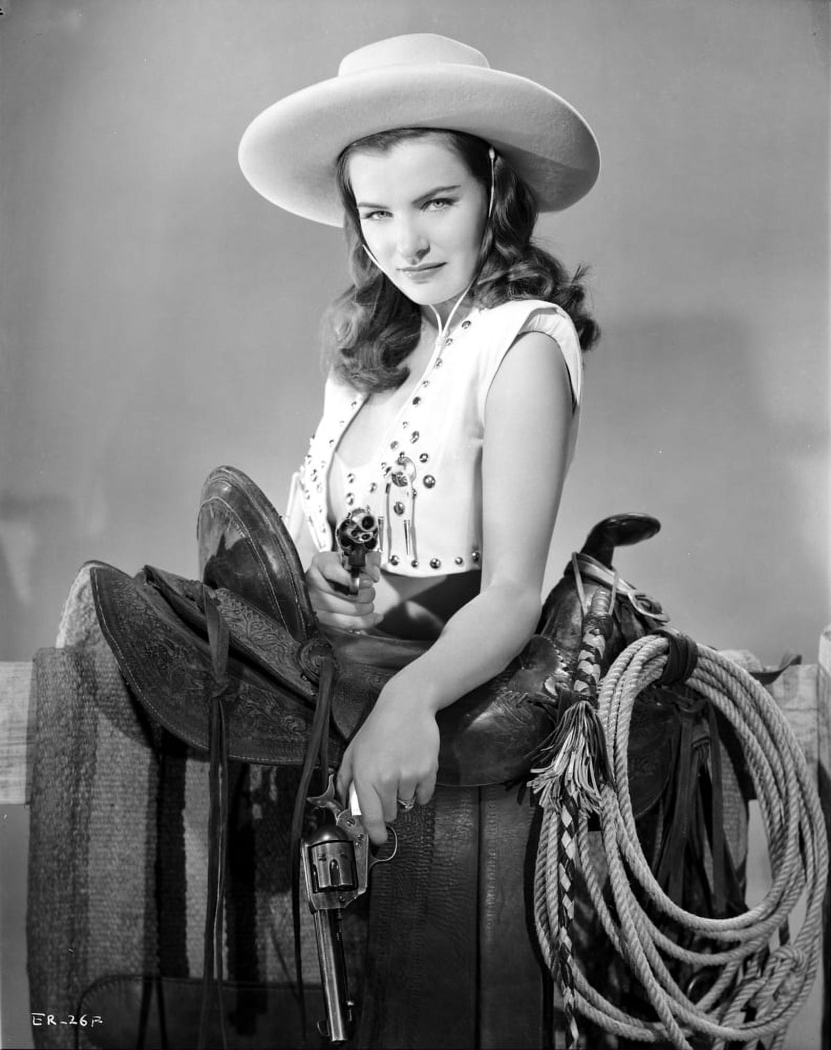 Ella Raines photo print in cowgirl outfit holding a pistol
