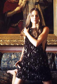 Michelle Phillips kneeling in black dress photo print.