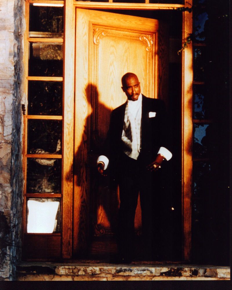 Tupac Shakur walking through doorway photo print in vibrant detail.