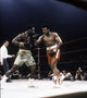 Muhammad Ali fighting Joe Frazier photo print, iconic boxing moment.