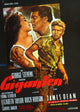 Giant movie poster featuring Elizabeth Taylor, Rock Hudson, and James Dean from the 1956 film.