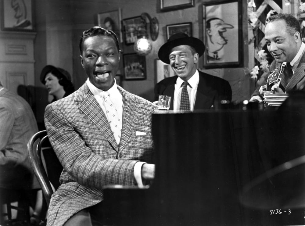 Nat King Cole performing photo print capturing a vintage musical moment.