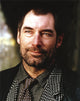 Timothy Dalton close up portrait photo print in black formal suit.
