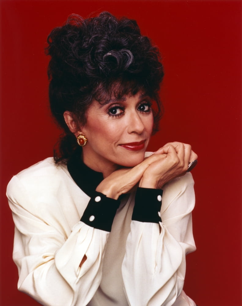 Elegant portrait photo print of Rita Moreno in white long sleeve attire.