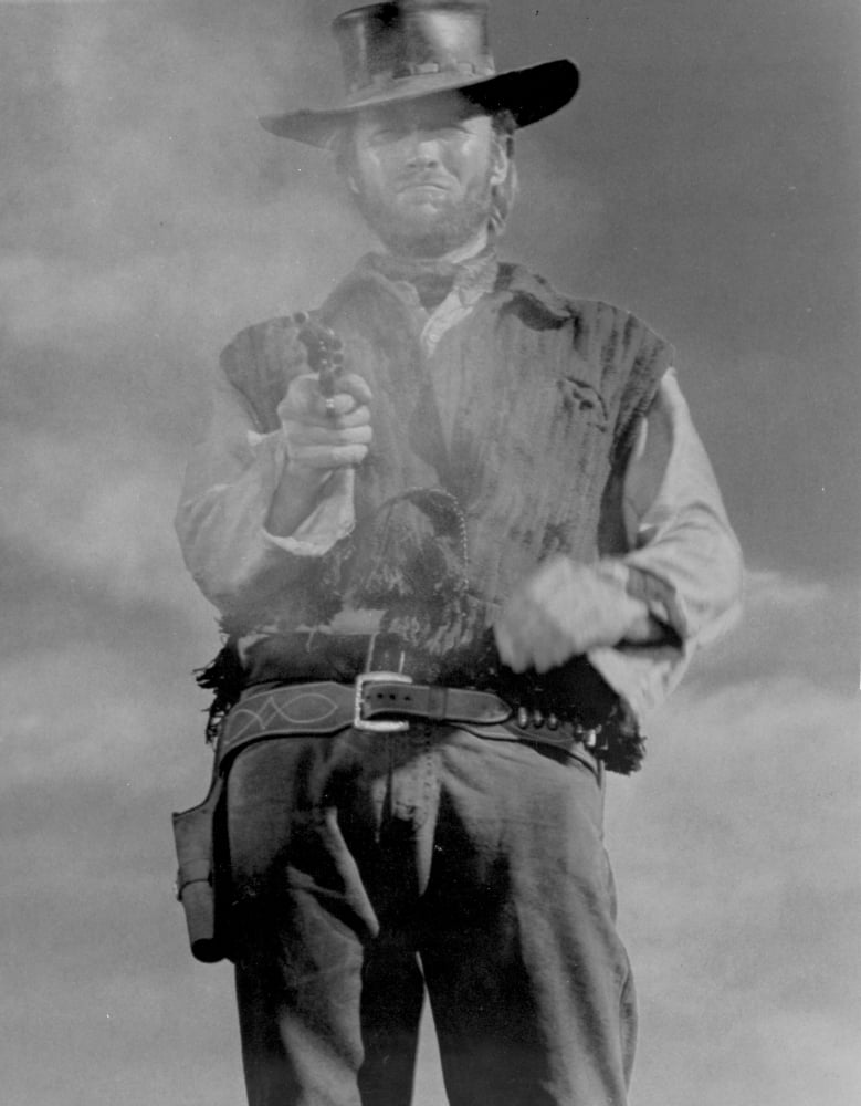 Clint Eastwood posed in cowboy outfit with pistol photo print