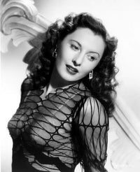 Barbara Stanwyck in a sheer top photo print, showcasing classic Hollywood glamour.