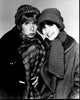 Black and white photo print of Penny Marshall and Cindy Williams in coats and hats from Laverne & Shirley.