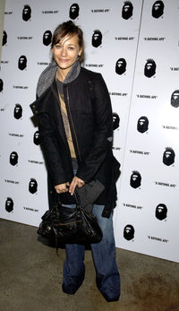 Rashida Jones carrying a Balenciaga bag at A Bathing Ape store opening in New York, January 11, 2005.