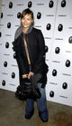 Rashida Jones carrying a Balenciaga bag at A Bathing Ape store opening in New York, January 11, 2005.