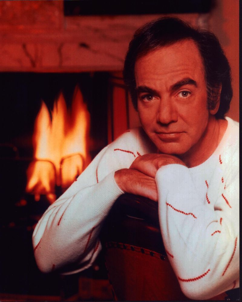 Neil Diamond photo print in front of a fireplace.