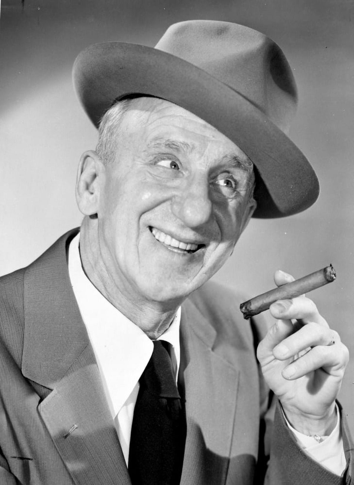 Jimmy Durante posed in a suit and cap photo print