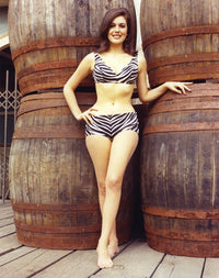 Portrait of Linda Harrison in an animal printed swimsuit photo print.