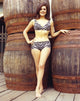 Portrait of Linda Harrison in an animal printed swimsuit photo print.