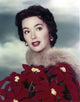 Close-up portrait of Barbara Rush in a red flower dress photo print