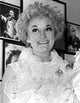 Phyllis Diller smiling portrait in white lace dress photo print.