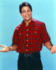 Tony Danza posed in checkered polo photo print.