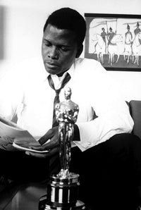 Sidney Poitier reading a newspaper with an Oscars statuette photo print