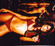 Elizabeth Hurley Red Bikini Photo Print featuring snake and apple motif.