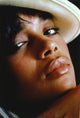 Close-up portrait photo print of Lisa Bonet wearing a hat