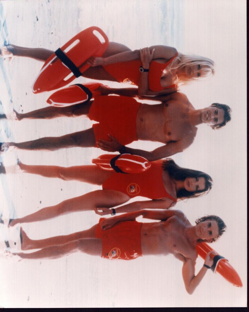 Baywatch lifeguards photo print featuring Pamela Anderson, Yasmine Bleeth, Jaason Simmons, and David Charvet.