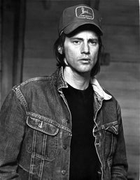 Sam Shepard photo print wearing denim jacket and cap