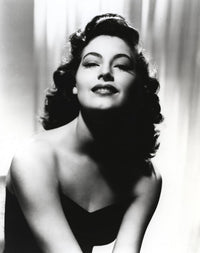 Black and white portrait of Ava Gardner in elegant black dress