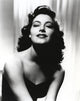 Black and white portrait of Ava Gardner in elegant black dress