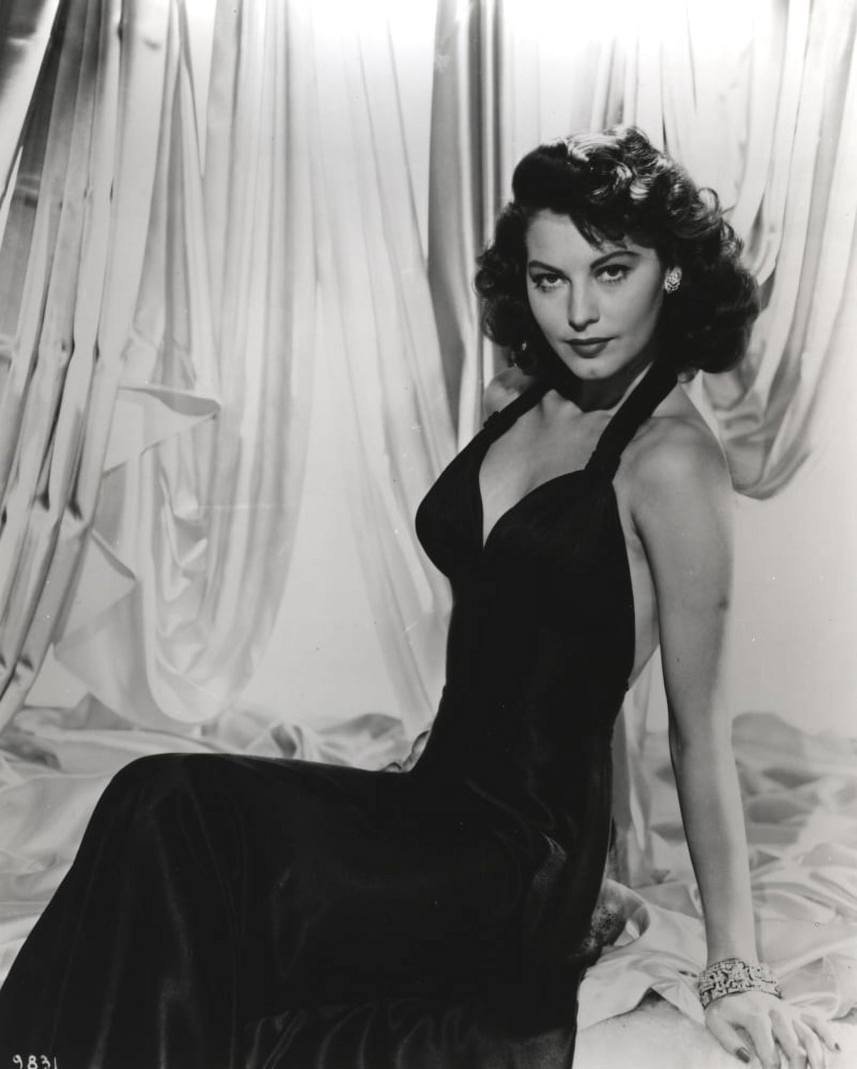 Ava Gardner reclining in a black gown photo print