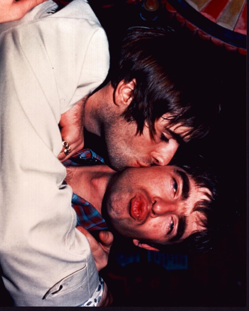 Liam Gallagher kissing Noel Gallagher on the cheek photo print