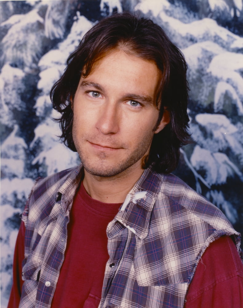 John Corbett posed in plaid vest photo print, available in multiple sizes.