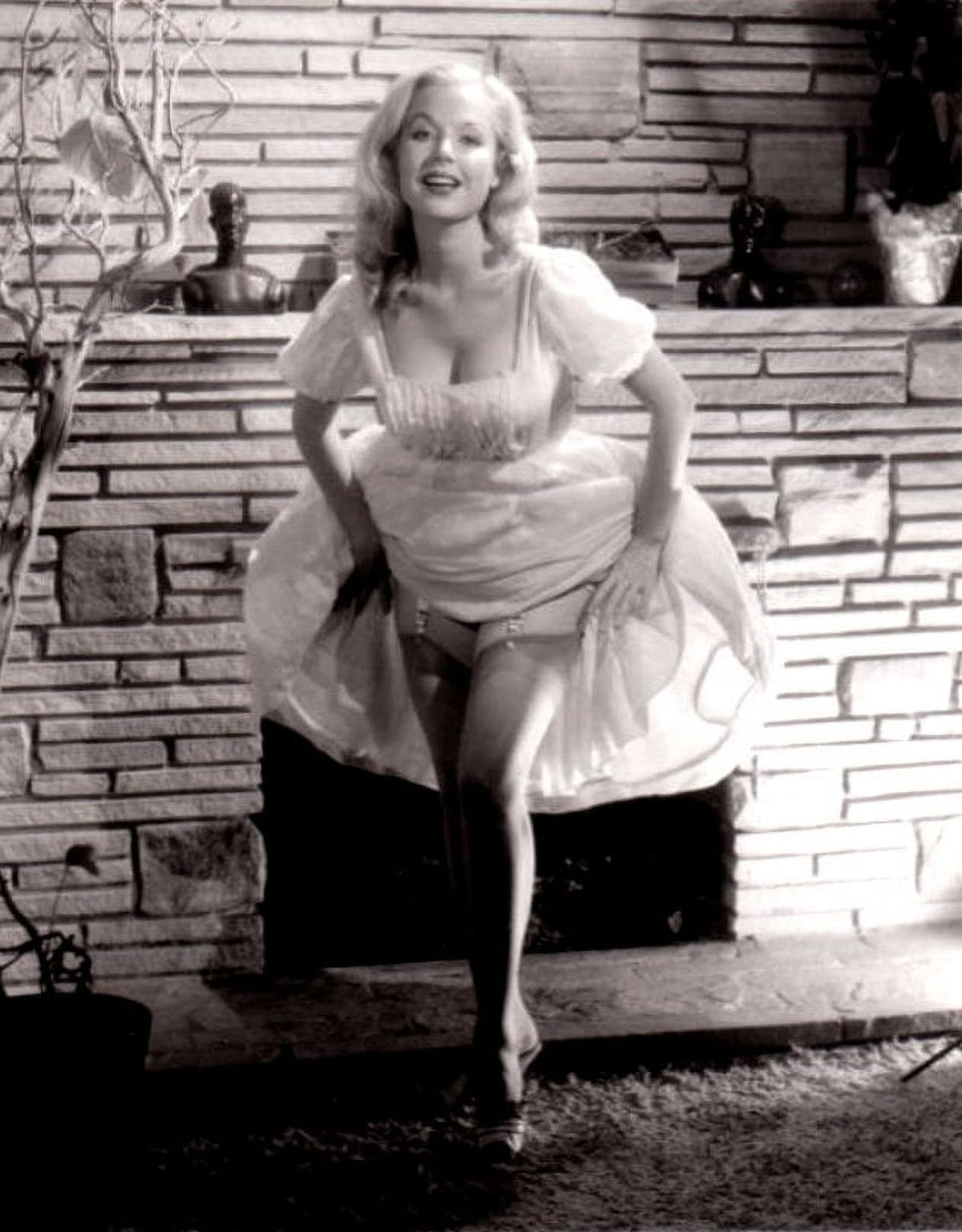 Betty Brosmer fireplace photo print available in multiple sizes.