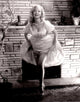 Betty Brosmer fireplace photo print available in multiple sizes.