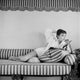 Audrey Hepburn reading a book photo print, available in multiple sizes.