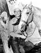 Roy Rogers Cowboy Photo Print featuring classic western attire with a horse.