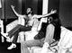 Maurice and Robin Gibb photo print on a sofa.